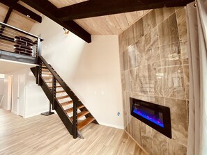 An electric fireplace sparks ambiance with the push of a button.