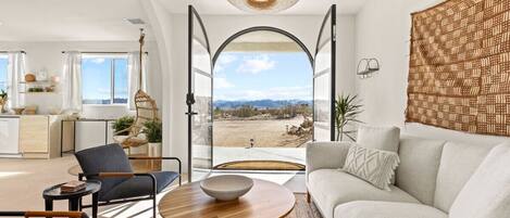 Open door, open possibilities - a living room with a view that invites serenity