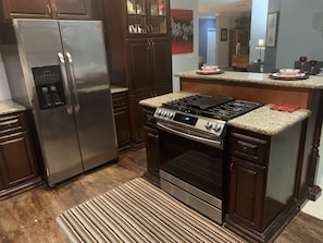 Double door refrigerator and five burner gas stove 