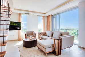 Floor-to-ceiling, wall-to-wall  sliding glass doors w/ocean view & private balcony