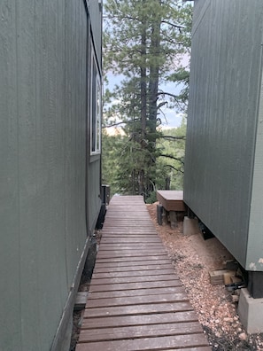 one of many walkways and decks around the property