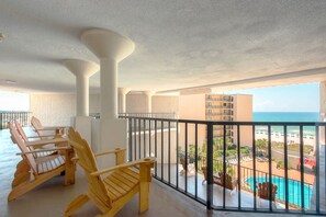 Covered Lounging space overlooks the Pool