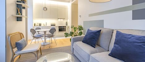 Spacious and modern living area with blue and grey accents and natural light in the heart of Lisbon. Perfect for relaxation and a memorable stay #andoliving #modern #relax #memorablestay #lisbon #pt #portugal