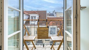 Wake up and start your day with Lisbon's fresh air and a stunning view of the city in this beautiful apartment. #andoliving #view #lisbon #pt #portugal