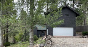 Parking in driveway. Cottage guest house over garage. 