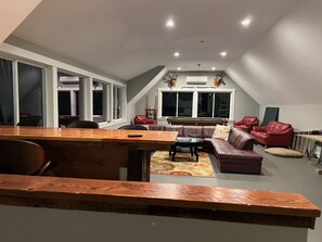 Bonus room with 85"TV, pool and ping pong table, built in bar and mountain views