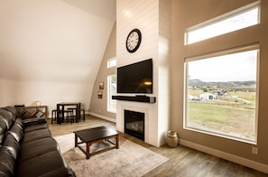 Main level view of fireplace and TV