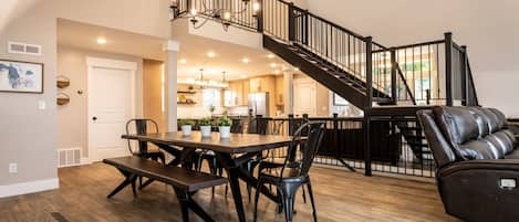 Main level view of dining table and kitchen