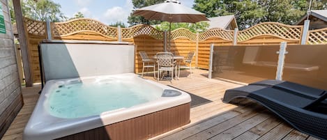 Decking with private hot tub and seating, perfect for relaxing and socialising