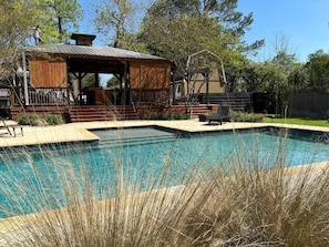 The pool and pavilion of The Ferns Guest House. This is a community-accessed feature, unless guests reserve "The Full Fern" listing.