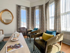 The parlor with designer furnishings, fixtures, & finishes! Several spots for conversation, study, and sipping a favorite beverage. The lighting in this space is refreshing.