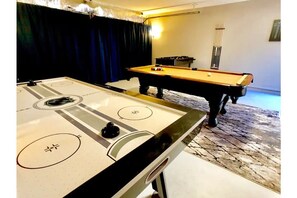 Your private rec room with BILLIARDS, AIR HOCKEY, FOOSBALL, DARTS and 3 ARCADES