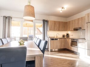 Furniture, Cabinetry, Countertop, Interior Design, Wood, Kitchen, Table, Lighting, Window, Building