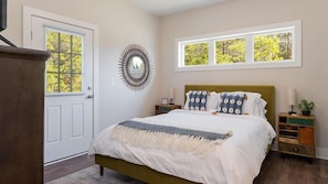 Second bedroom with access to back patio.