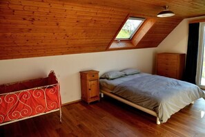 family room with childrens bed and balcony facing west
