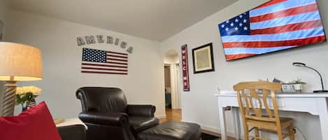 Inviting Living Room includes 2 Brown Leather Chairs with Ottomans, Couch& 65TV!