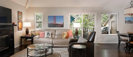 like a treehouse! bright and open living space with view of the trees
