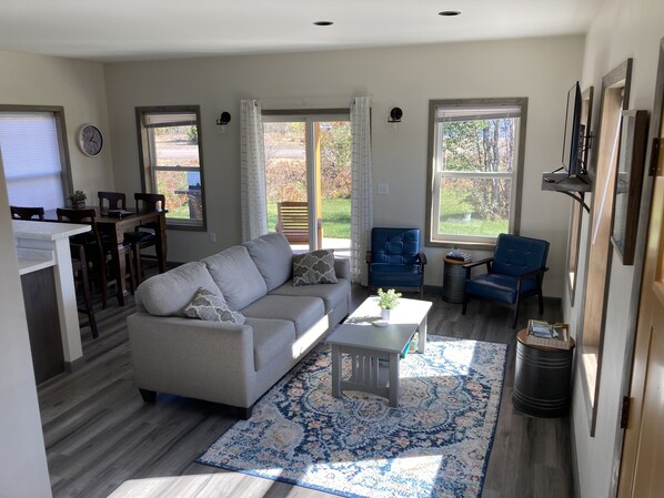 Lower level open concept with living area and dining space 