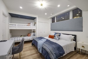 Second guest bedroom with king bed, desk and bunk beds looking at the stars