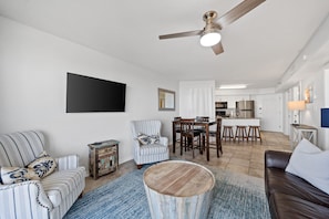 Full view of living room, dining area, and kitchen