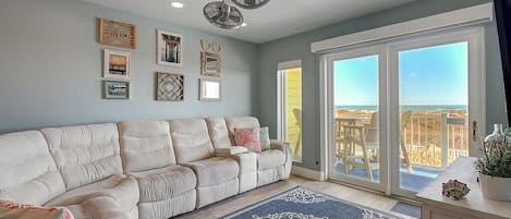 Enjoy beach views from the living room while watching TV.