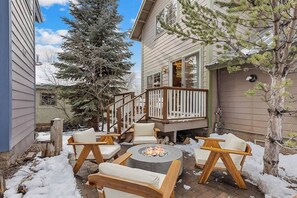 Private backyard with gas firepit and lounge area, perfect for coffee in the morning, and cocktails in the evening.