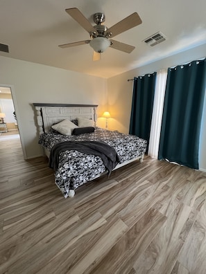 Master suite has slider to back yard and pool