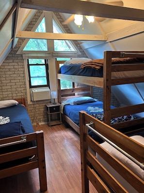 West Bed room has 4 beds, window AC, ceiling fan & lights