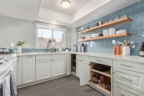 Fully stocked kitchen with stove, dishwasher, microwave, toaster, plates & more!