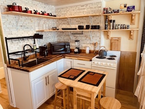 Kitchen with pull out dinning table and chairs.