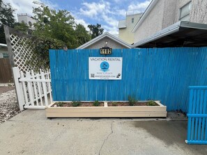 Tucked behind a fence, Mike’s Place gives you privacy and parking for 2.