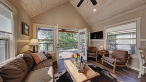 Livingroom of Speed'y's Live Oak Lodge is rustit with outdoor Hill County Charm.