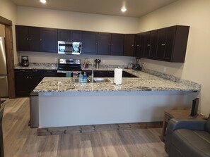 State of the art kitchen with granite countertops.