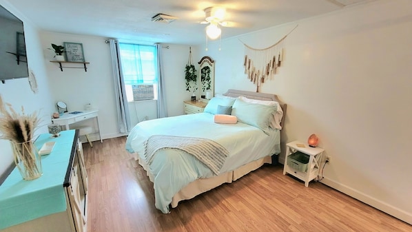 Bedroom with a super comfortable queen bed, dresser, and TV with Firestick.