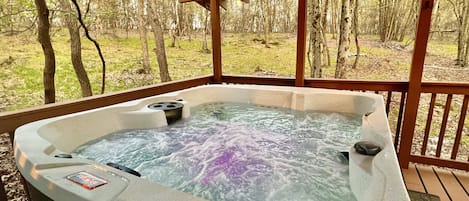 Get toasty in our 6 person hot tub with fun string lights and epic forest views.