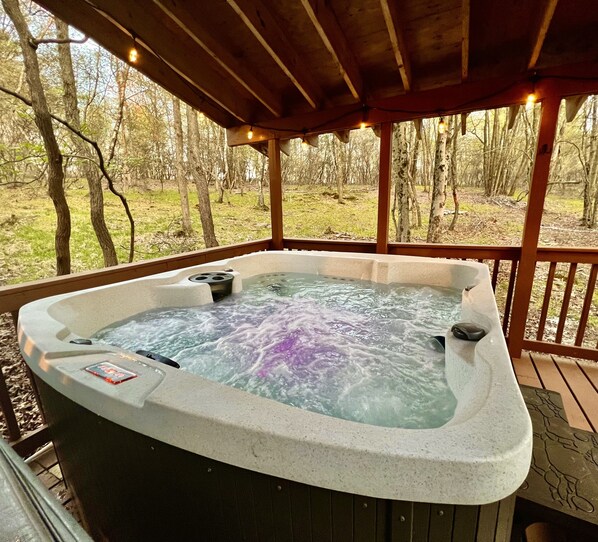 Get toasty in our 6 person hot tub with fun string lights and epic forest views.