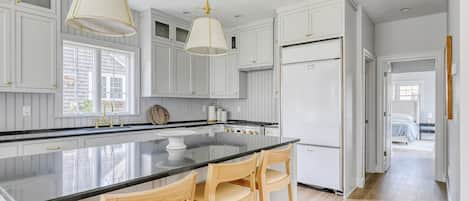 Remodeled kitchen. Cabinet panel will go on refrigerator and freezer.