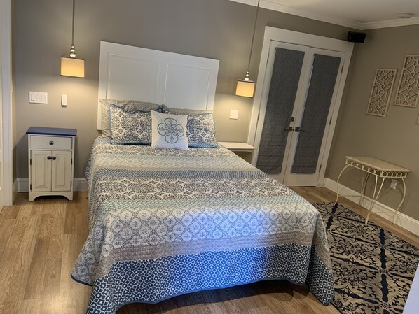Queen bed. Double doors lead to large screened porch.