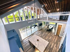 View of kitchen and dining room from the 3rd floor loft bedroom