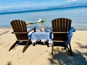 sitting just outside the house on the beach, looking out to sea!