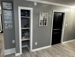 Pantry area to store your snacks! Door leads to accessible primary bathroom.
