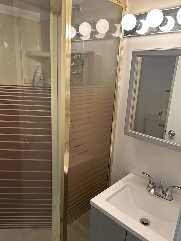 Bathroom mirror and sink and cabinet