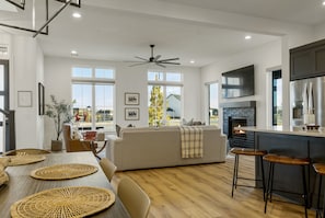 Open-concept living, kitchen and dining spaces
