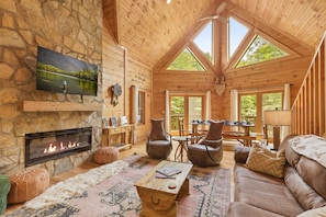 Spacious great room with 25' vaulted ceilings and cozy fireplace.