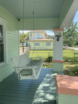 Enjoy Gulf breezes on the front porch swing. 