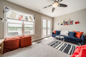 Top floor movie loft with big screen TV.