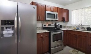 Cook everyday meals in this well equipped kitchen.