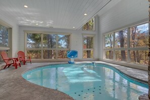 Indoor heated pool on lower level of cabin. 