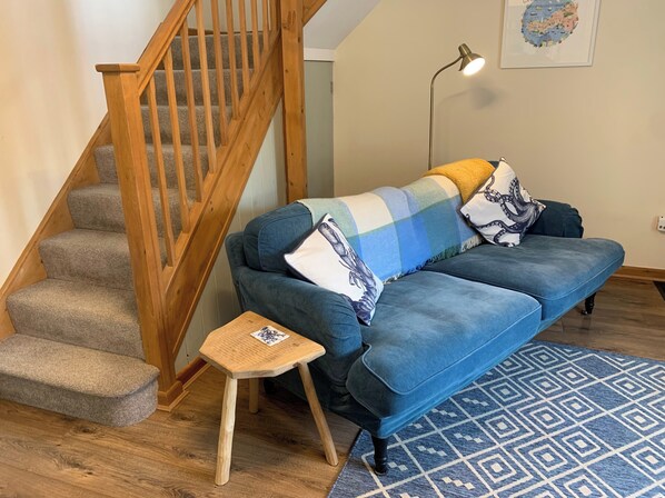 Comfy sofa and handmade side tables from local craftsman