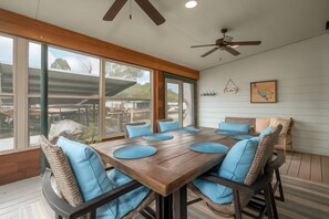 Relaxing by the lake in our cozy Sun Porch | Dining Table for 6